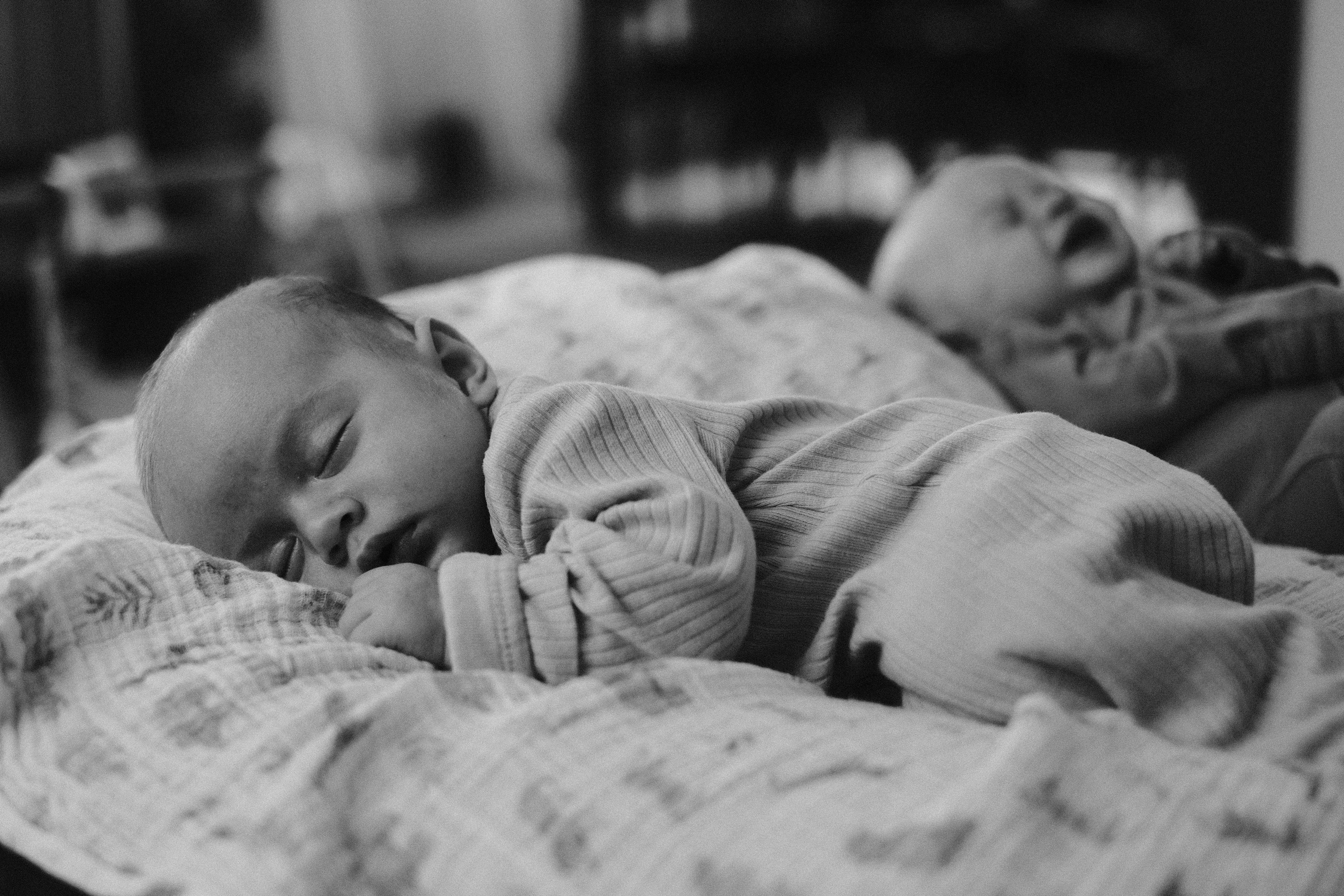 Carl standing with a camera, black and white documentary-style
