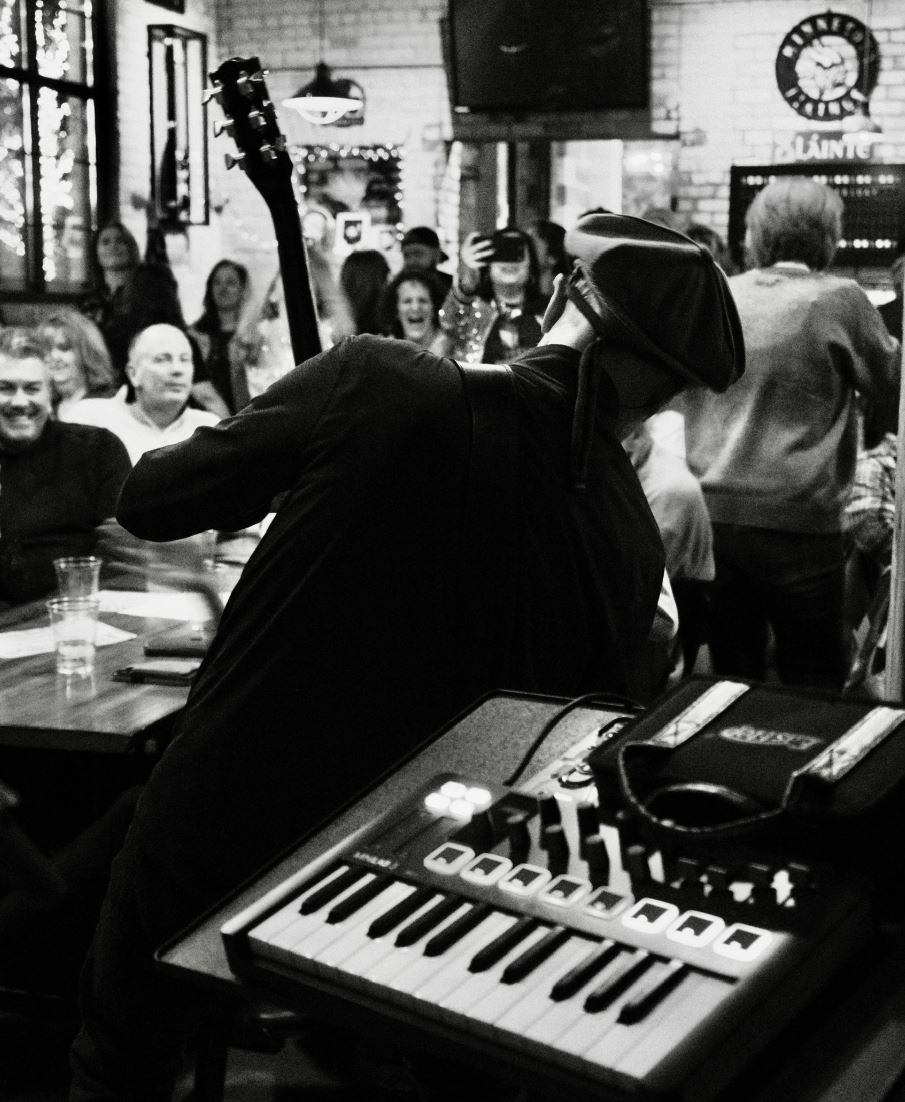 Live concert lighting with performer on stage